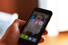 iPhone with icons of Meta
